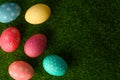Easter eggs colored on green grass. Congratulations on Easter. Horizontal frame Royalty Free Stock Photo