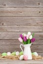 Easter eggs and colorful tulips bouquet Royalty Free Stock Photo