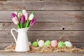 Easter eggs and colorful tulips Royalty Free Stock Photo