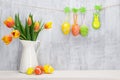 Easter eggs and colorful tulips bouquet Royalty Free Stock Photo