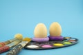 Easter eggs coloring concept on blue background
