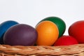 Easter eggs colors in basket white background