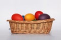 Easter eggs colors in basket white background