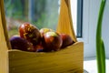 Easter eggs are coloured by the ancient onion husk method with various natural patterns in box by window in sunshine on beige