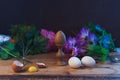 Easter eggs in composition with flowers in rustic style,