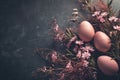 Easter eggs on dark background. Moody atmospheric image. Generative AI