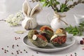 Easter eggs decorated with different spices and cereals without dyes and preservatives on a plate on a gray concrete background Royalty Free Stock Photo