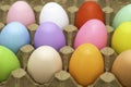 Easter eggs of different colors in a cardboard egg tray Royalty Free Stock Photo
