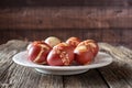 Easter eggs dyed with onion peels with a pattern of fresh herbs on a plate Royalty Free Stock Photo