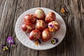 Easter eggs dyed with onion peels with a pattern of herbs Royalty Free Stock Photo