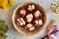 Easter eggs dyed with onion skins with a pattern of herbs, top view Royalty Free Stock Photo