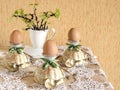 Easter eggs in eggcups with gold spoons Royalty Free Stock Photo