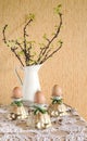 Easter eggs in eggcups with gold spoons Royalty Free Stock Photo