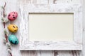 Easter eggs and empty vintage photo frame background Royalty Free Stock Photo
