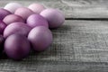 Easter eggs in fashionable colors on a gray wooden background Royalty Free Stock Photo