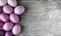 Easter eggs in fashionable colors on a gray wooden background Royalty Free Stock Photo