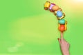 Female hand with colorful easter eggs in lorry car toy Royalty Free Stock Photo