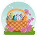 Easter eggs with figures decoration inside basket