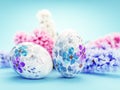 Easter eggs with floral pattern on blue background