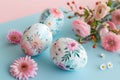 Easter eggs with flower pattern and spring flowers on soft blue and pink background. easter card Royalty Free Stock Photo