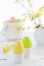 Easter eggs and flowering branches on wooden table Royalty Free Stock Photo