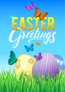 Easter eggs in Fresh Green Grass. Decorated Easter Eggs in Grass on Sky Background. Happy Easter Calligraphy Poster Royalty Free Stock Photo