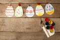 Easter eggs garland on wooden vintage rustic background, copy space, flat lay Royalty Free Stock Photo