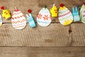 Easter eggs garland on wooden vintage rustic background, copy space, flat lay Royalty Free Stock Photo