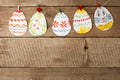 Easter eggs garland on wooden vintage rustic background, copy space, flat lay Royalty Free Stock Photo