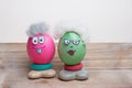 Easter eggs for grandma and grandpa, funny senior faces with big eyes and glasses. handiwork