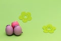 Easter eggs on green background with flowers. Purple decorative Easter eggs with decorative flowers. Purple egg and egg cup. Blue Royalty Free Stock Photo