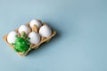 Easter eggs with a green egg decorated as coronavirus. Easter creative concept