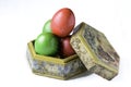 Easter eggs on a handmade box isolated on White.