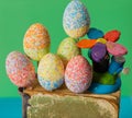 Easter eggs with handmade flower on book