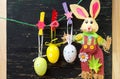 Easter eggs hanging from a string and a bunny