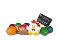 Easter eggs, Happy Easter text and chicken toy isolated on white background Royalty Free Stock Photo