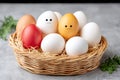 Easter eggs with happy and sad faces in basket Royalty Free Stock Photo
