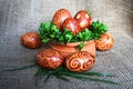 Easter Eggs with spiral pattern on jute Royalty Free Stock Photo