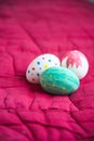 Easter eggs lying on a red background