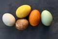 Easter eggs natural dyed on wooden background. Natural coloring of eggs.