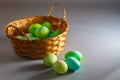Easter eggs of natural dyes in harmony with nature in a wicker basket made of straw Royalty Free Stock Photo