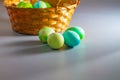 Easter eggs of natural dyes in harmony with nature in a wicker basket made of straw Royalty Free Stock Photo