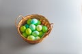 Easter eggs of natural dyes in harmony with nature in a wicker basket made of straw Royalty Free Stock Photo