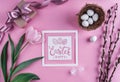 Easter eggs in nest and tulips flowers on pink background with Easter card. Waiting for spring. Royalty Free Stock Photo