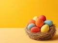 Easter eggs nest yellow background Royalty Free Stock Photo