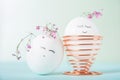 Easter eggs with painted face as concept for festive spring card Royalty Free Stock Photo