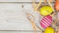 Easter eggs painted in pastel colors on white wooden background. Easter concept Royalty Free Stock Photo