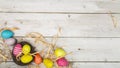 Easter eggs painted in pastel colors on white wooden background. Easter concept Royalty Free Stock Photo