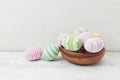 Easter eggs painted in pastel colors on white wooden background. Easter concept Royalty Free Stock Photo