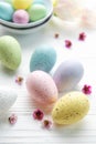 Easter eggs painted pastel colors on a white wooden background Royalty Free Stock Photo